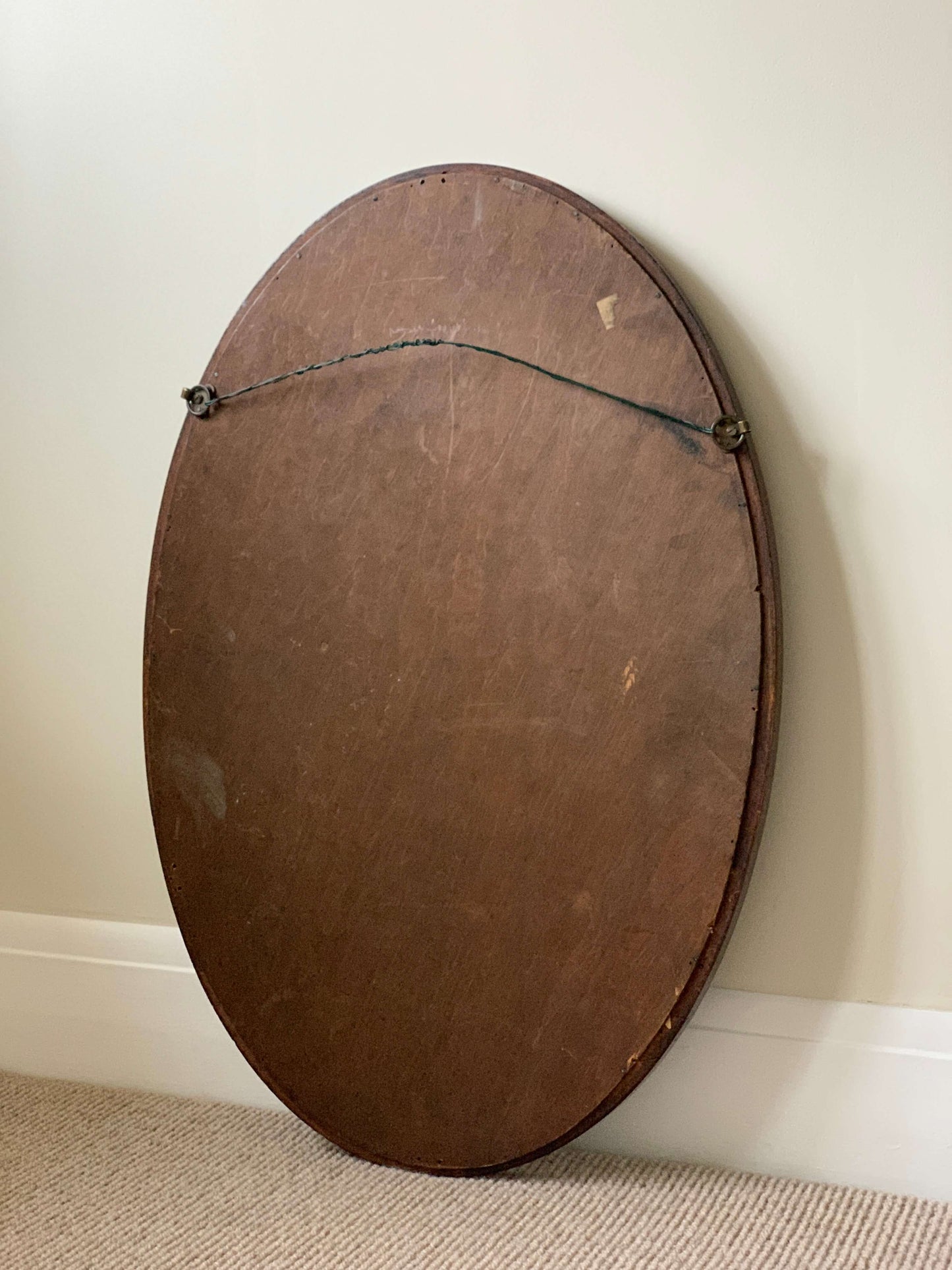 Antique oval walnut veneered mirror