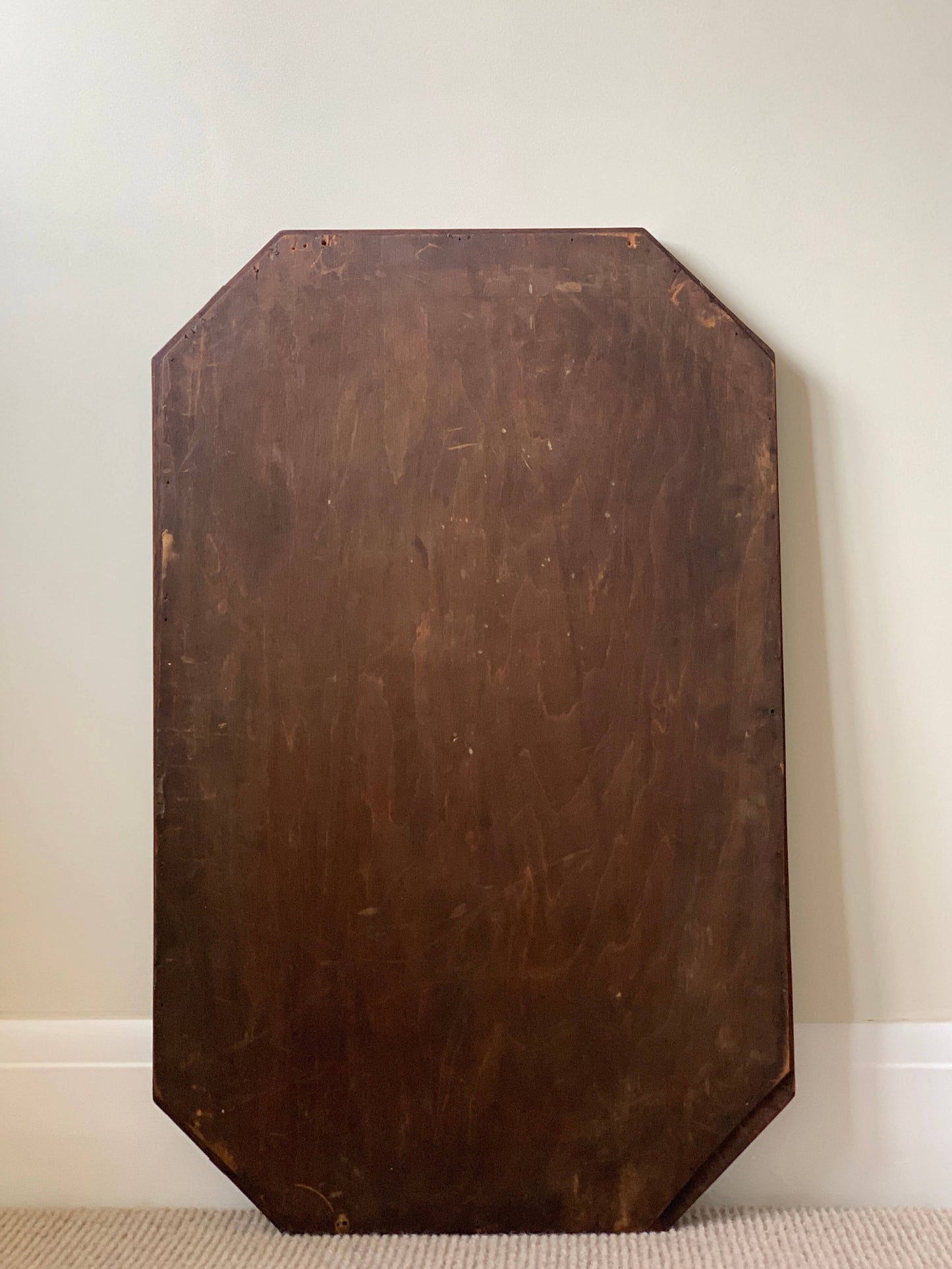Antique octagonal mirror with carved details