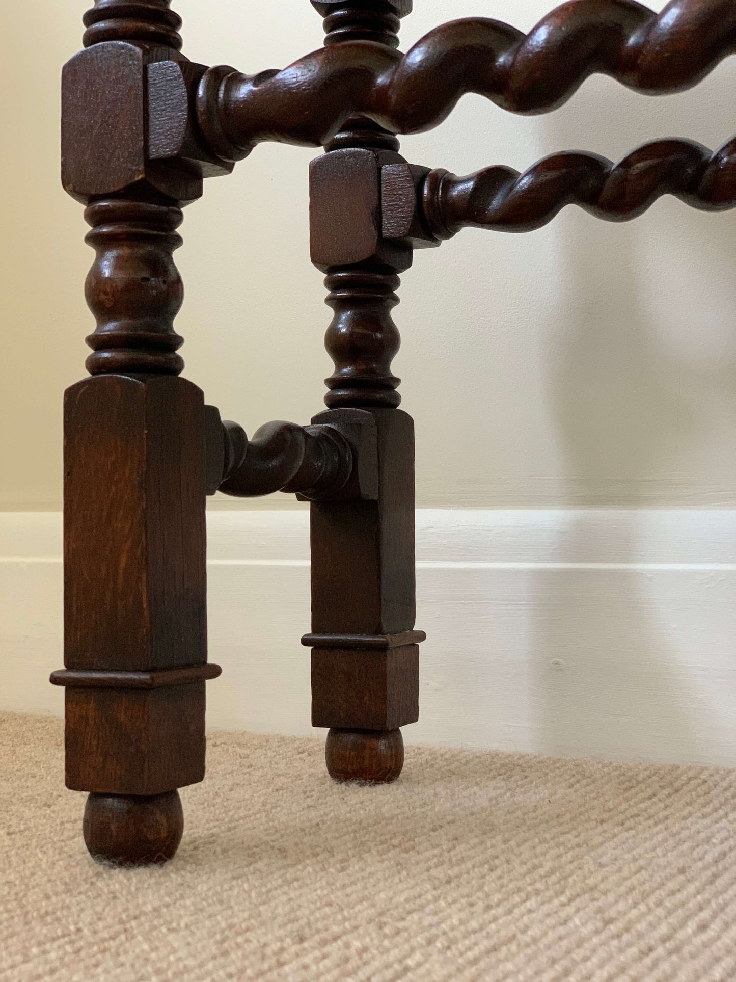 Antique cane stool with twisted detailing