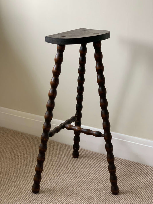 Tall French antique bobbin stool with demilune top